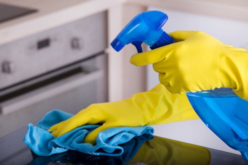 Carpet cleaning technician preparing equipment with safety focus