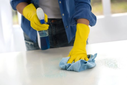 Safe carpet cleaning in progress with attention to manual handling and floor safety